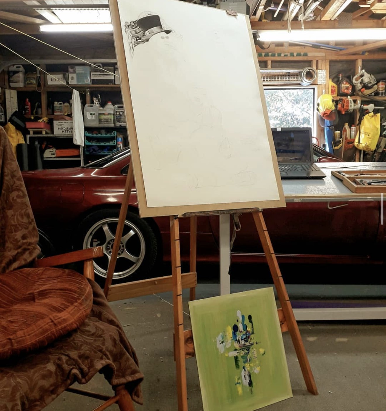Emma's workshop, easel and canvas in progress